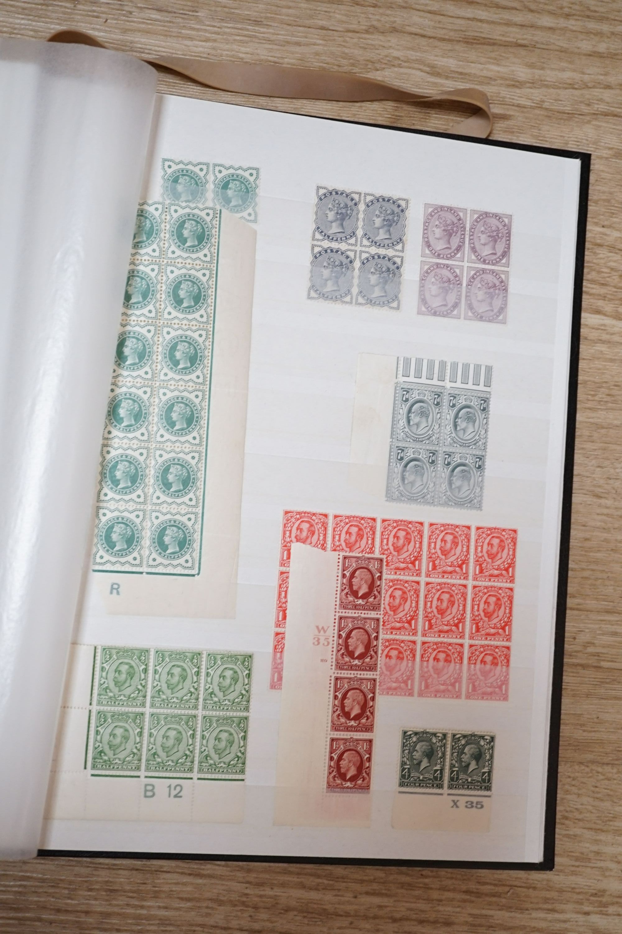 Great Britain stamps in stock book with 1840 1d black and 1841 2d blue unused. 1841 1d red brown mint block of 8, 1864-79 1d red plates in mint blocks including plate 79 block of 48, plate 170 block of 6 with marginal in